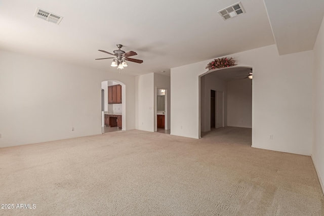 spare room with ceiling fan and carpet flooring