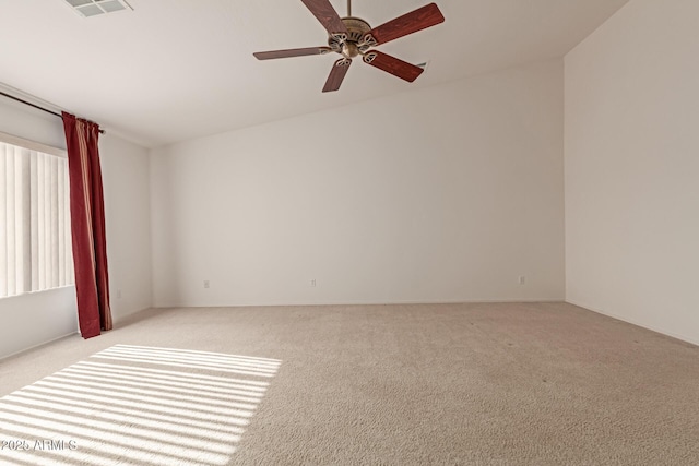 unfurnished room featuring ceiling fan and light colored carpet