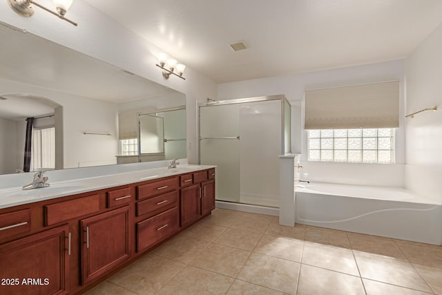 bathroom with vanity, independent shower and bath, and tile patterned flooring