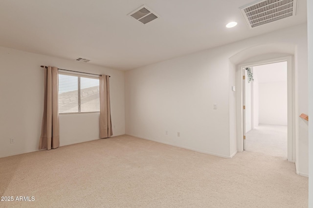 spare room with light colored carpet