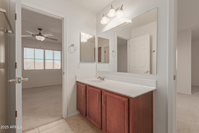 bathroom featuring ceiling fan, tile patterned floors, and vanity