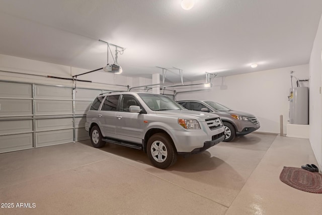 garage featuring a garage door opener and water heater