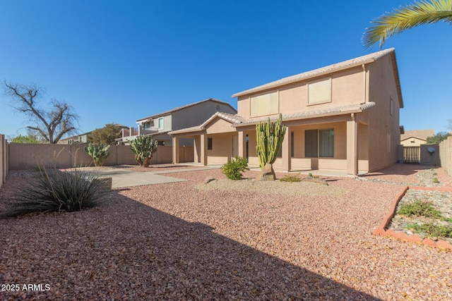 back of property featuring a patio area