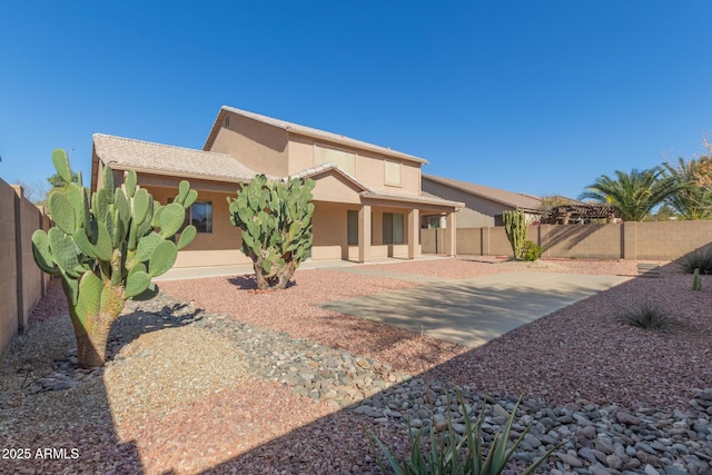 back of house featuring a patio