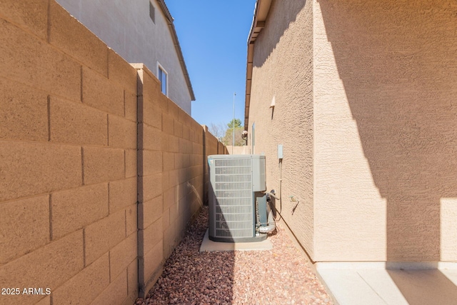 view of property exterior featuring central AC