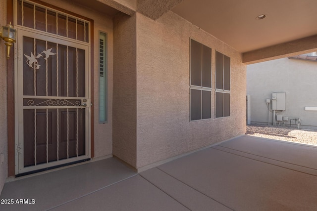 property entrance with a patio