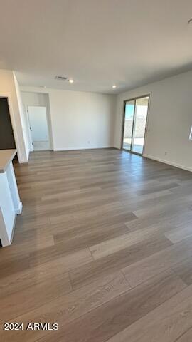 unfurnished room with light wood-type flooring