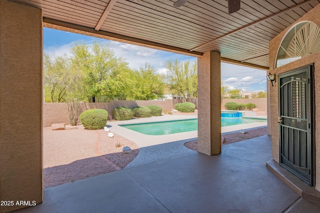 view of patio / terrace with a fenced in pool, ceiling fan, and a fenced backyard