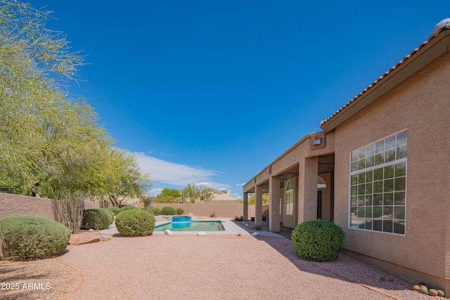 view of swimming pool featuring a fenced backyard, a fenced in pool, and a patio area