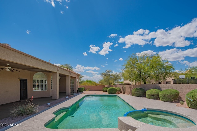 view of swimming pool with a fenced backyard, a ceiling fan, a patio, and a pool with connected hot tub