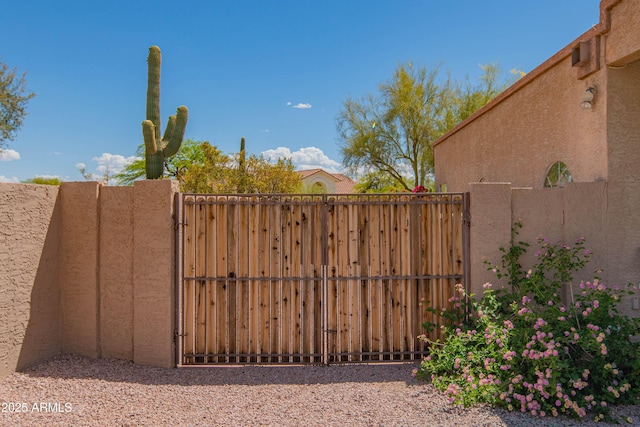 view of gate featuring fence