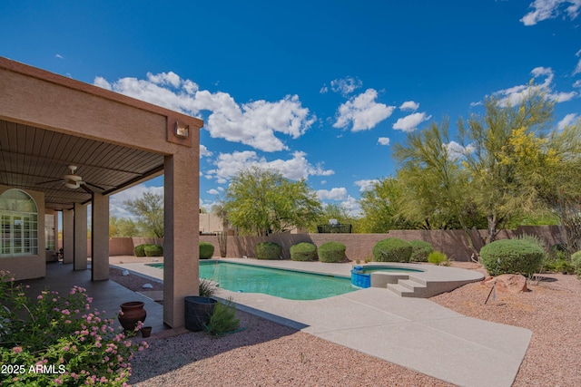 view of pool with a ceiling fan, a patio area, a fenced backyard, and a pool with connected hot tub