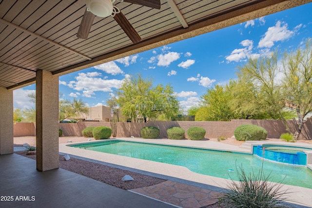 view of pool featuring a fenced backyard, a ceiling fan, a patio area, and a pool with connected hot tub