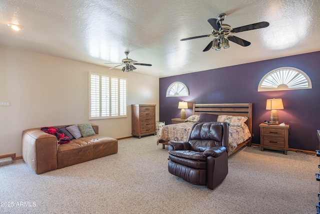 bedroom with baseboards, a ceiling fan, carpet, and multiple windows