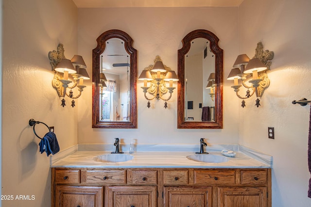 full bathroom featuring double vanity, a sink, and a chandelier