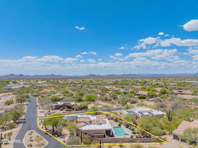 drone / aerial view featuring a residential view and a mountain view