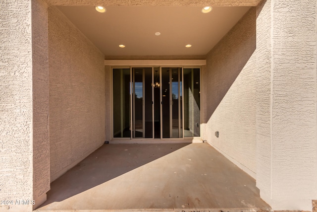 entrance to property with a patio