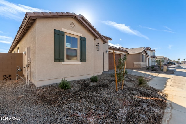 view of property exterior with a garage