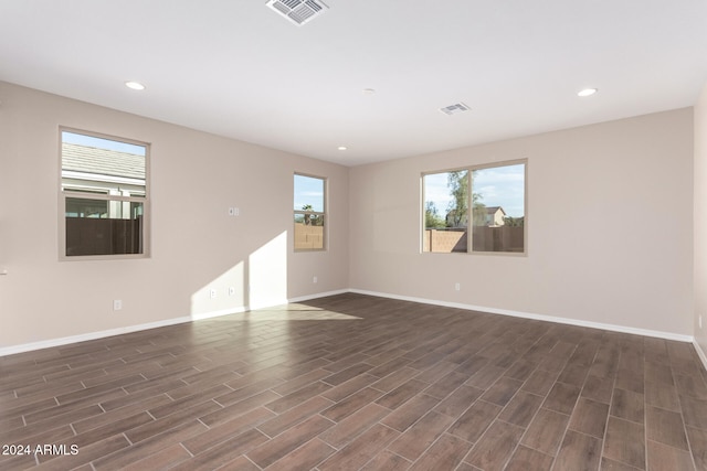 spare room featuring dark hardwood / wood-style floors