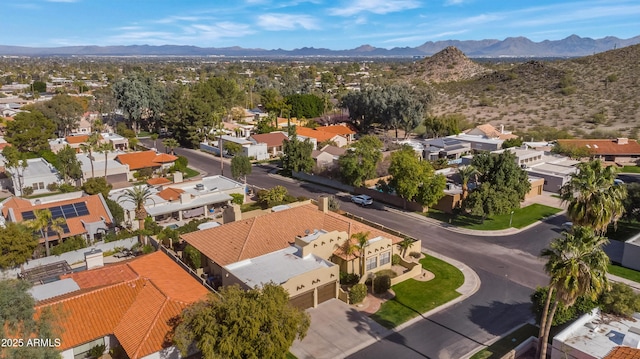 birds eye view of property featuring a mountain view