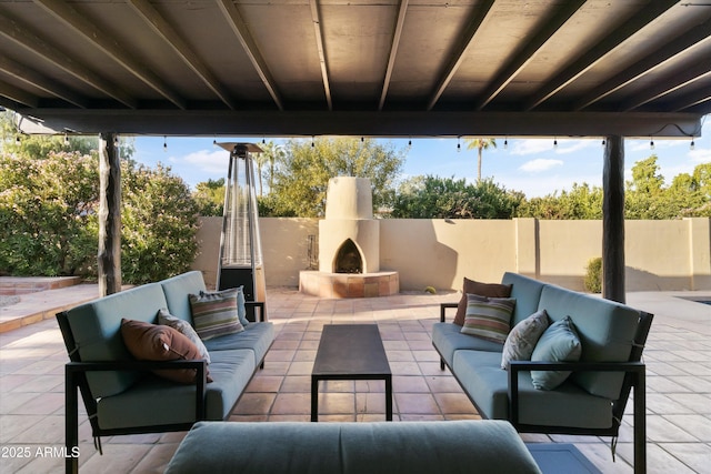 view of patio / terrace featuring an outdoor living space with a fireplace