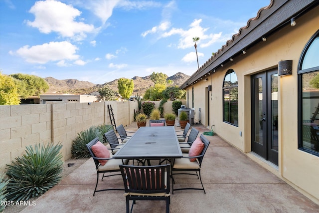 view of patio / terrace featuring a mountain view