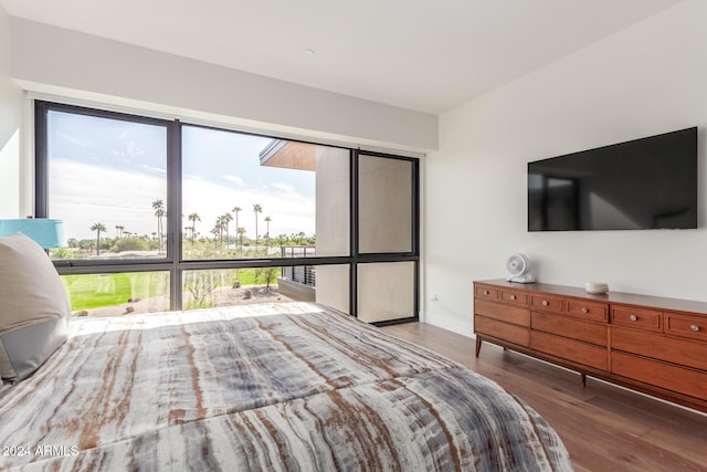 6311 E Phoenician Blvd Unit 18, Scottsdale, AZ 85251 - bedroom with wood finished floors, multiple windows, and baseboards