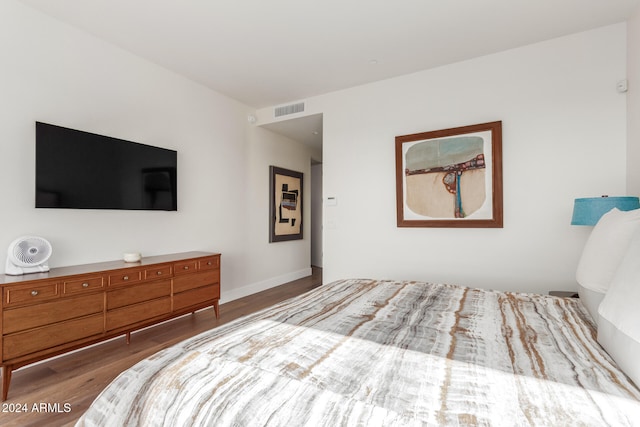 bedroom featuring wood-type flooring