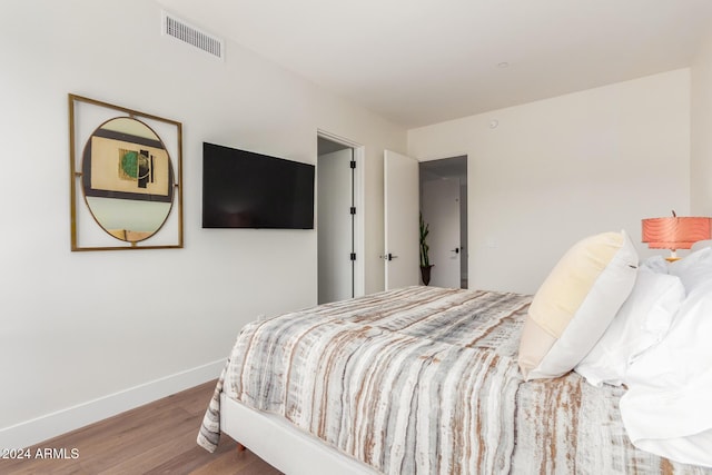 6311 E Phoenician Blvd Unit 18, Scottsdale, AZ 85251 - bedroom with wood finished floors and baseboards