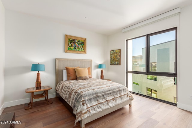 6311 E Phoenician Blvd Unit 18, Scottsdale, AZ 85251 - bedroom with light wood-style flooring and baseboards