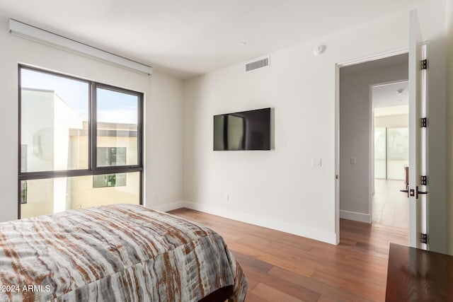 6311 E Phoenician Blvd Unit 18, Scottsdale, AZ 85251 - bedroom with hardwood / wood-style flooring and baseboards
