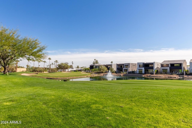 6311 E Phoenician Blvd Unit 18, Scottsdale, AZ 85251 - view of home's community with a water view and a yard