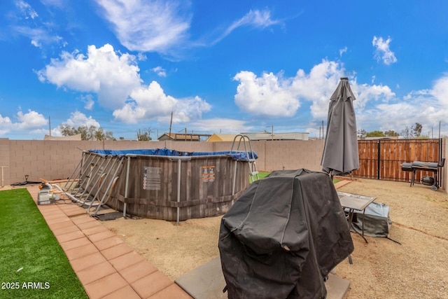 view of yard with a fenced backyard and a fenced in pool