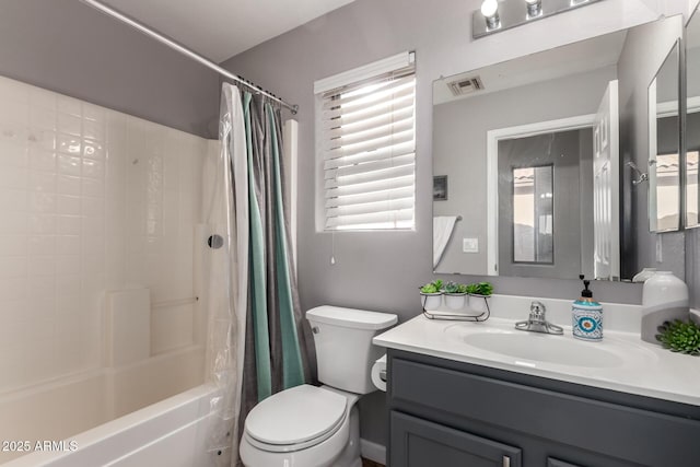 full bath with toilet, shower / bath combo, visible vents, and vanity