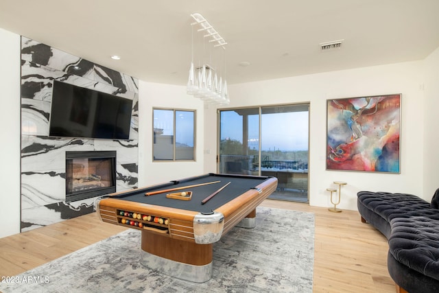 playroom with light hardwood / wood-style flooring and pool table