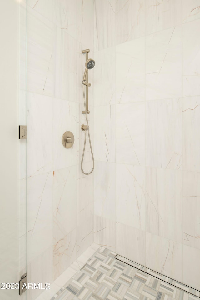 bathroom with a tile shower