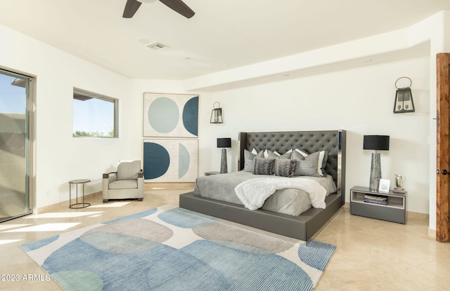 bedroom with ceiling fan and light tile floors