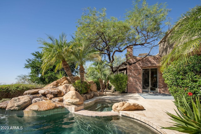 view of pool featuring a patio area