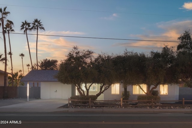 view of front of property featuring a fenced front yard and stucco siding