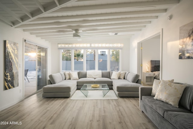 sunroom featuring beam ceiling and ceiling fan