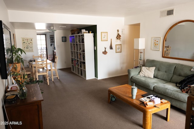 living room with visible vents and carpet floors