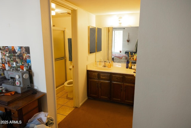 bathroom with a shower stall, tile patterned floors, vanity, and visible vents