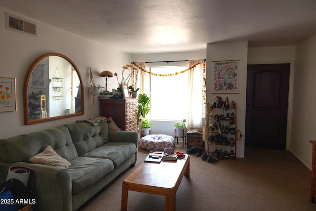 living room with visible vents and carpet