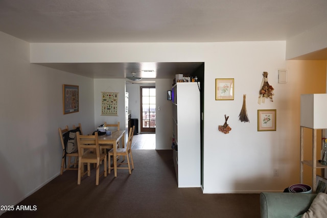 dining area featuring baseboards