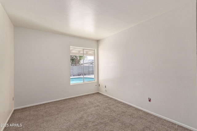 empty room featuring carpet flooring