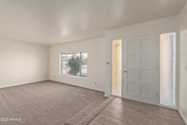 entryway with light hardwood / wood-style floors