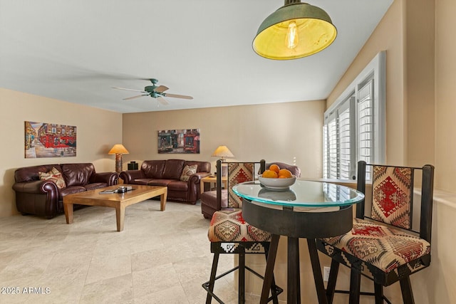 dining room featuring ceiling fan