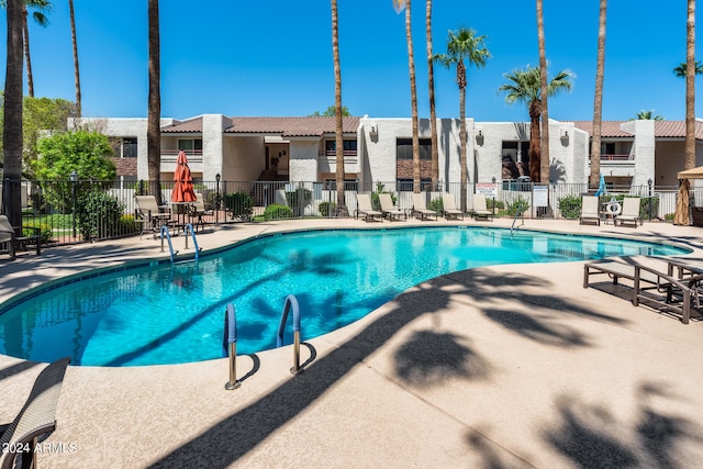 view of swimming pool with a patio