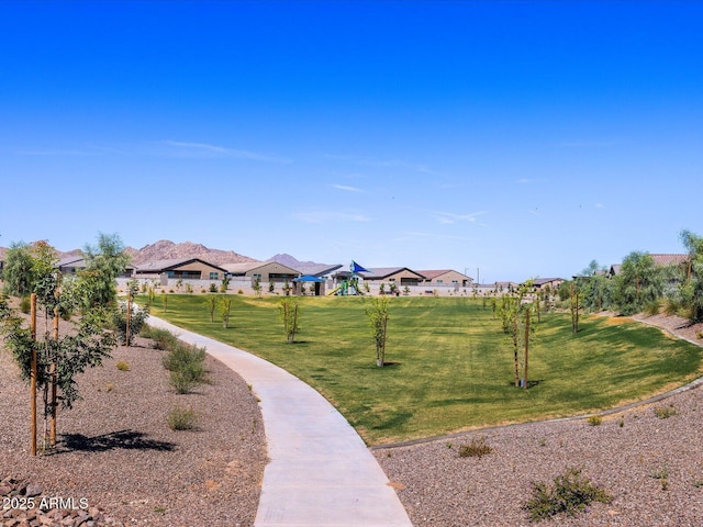 view of property's community featuring a lawn