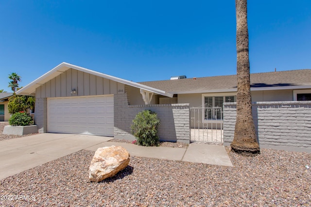 ranch-style home featuring a garage